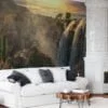 Breathtaking Waterfall Wallpaper with Majestic Mountains and a Radiant Sunset for a Serene and Scenic Home Ambiance