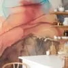 Experience the mesmerizing beauty of mixed alcohol ink colors dancing in water with our captivating wallpaper design