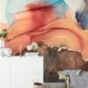 Experience the mesmerizing beauty of mixed alcohol ink colors dancing in water with our captivating wallpaper design