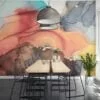 Experience the mesmerizing beauty of mixed alcohol ink colors dancing in water with our captivating wallpaper design