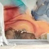 Experience the mesmerizing beauty of mixed alcohol ink colors dancing in water with our captivating wallpaper design